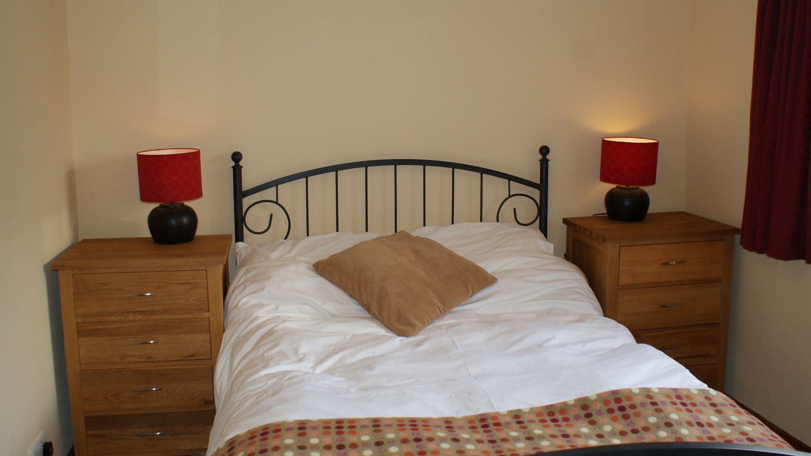 Double bed in Mincorn Holiday Cottage with local Melyn Ty Gwynt throw