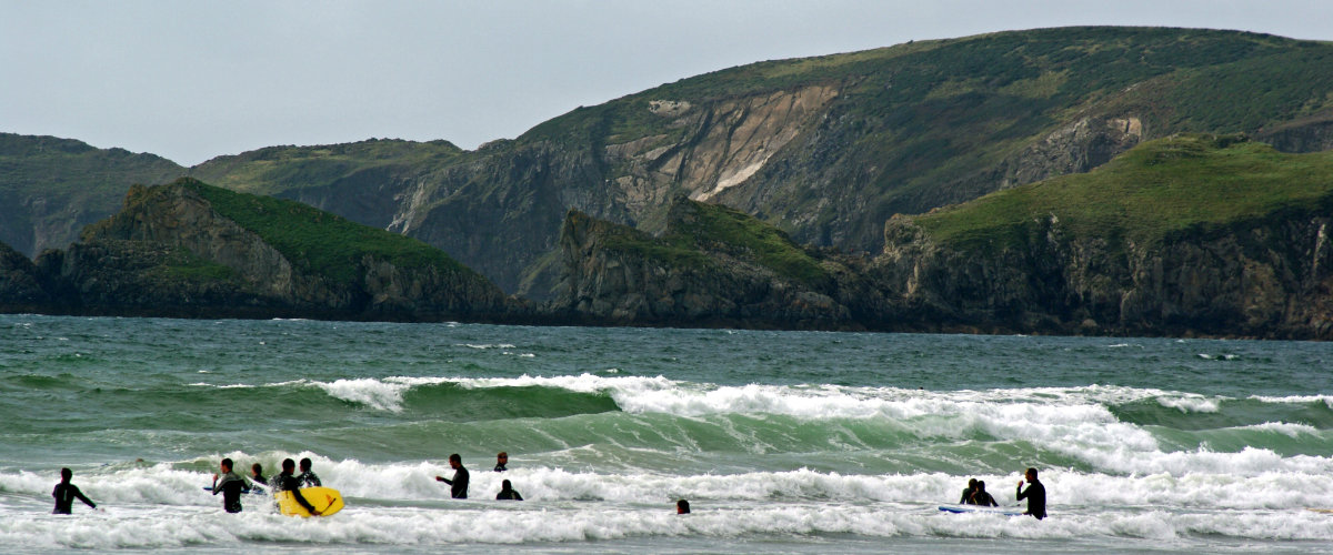Surfing at Newgale Beach